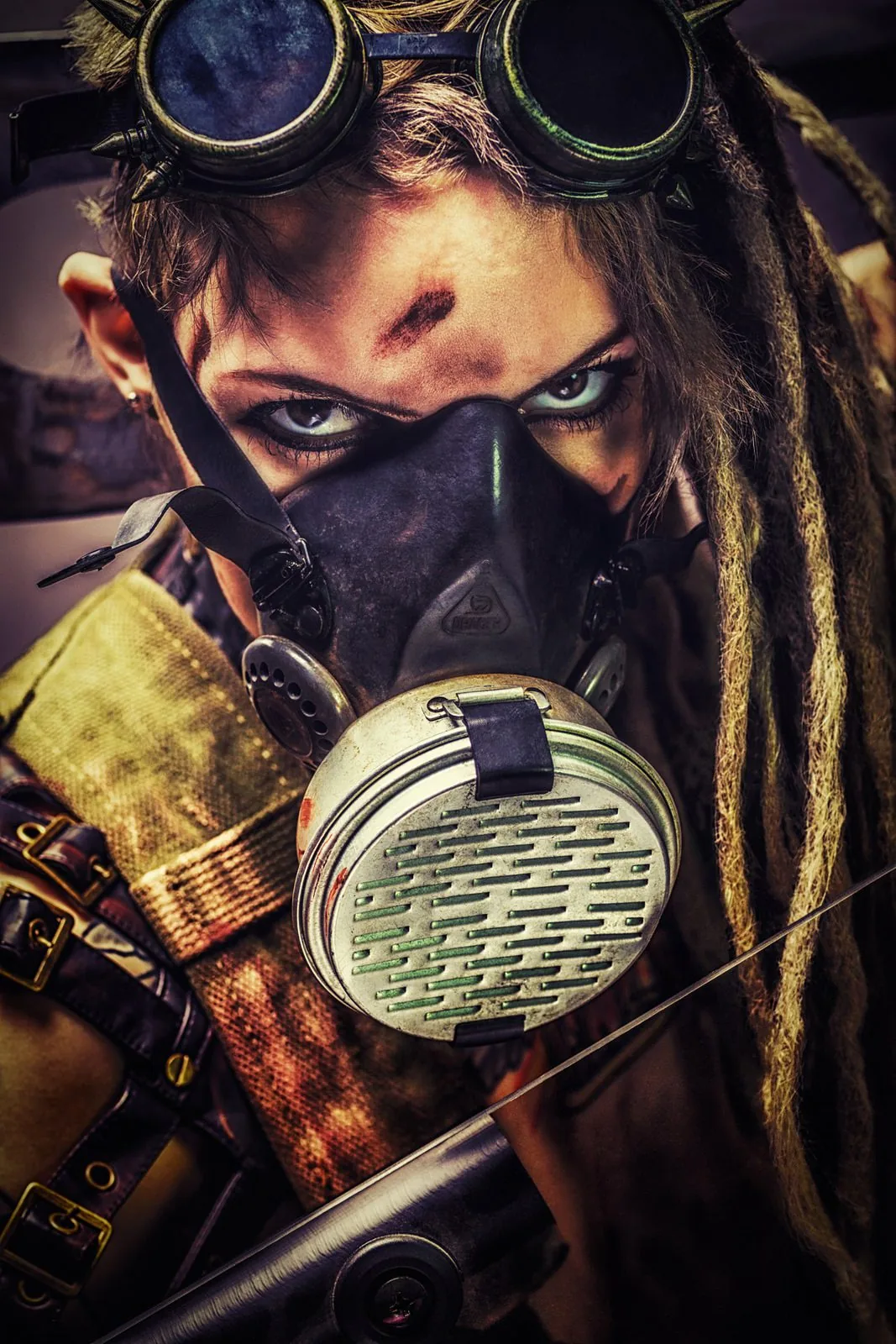 Portrait with goggles, a respirator and dreadlocks in a post-apocalyptic look